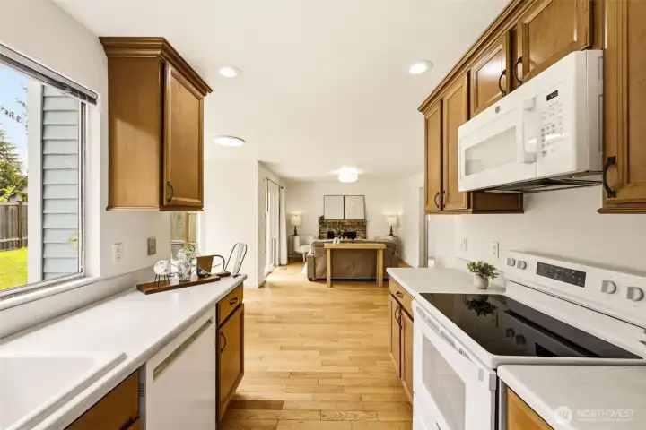 Updated kitchen with abundant cabinetry, functional workspace, and views of the backyard. Updated kitchen with abundant cabinetry, functional workspace, and views of the backyard.