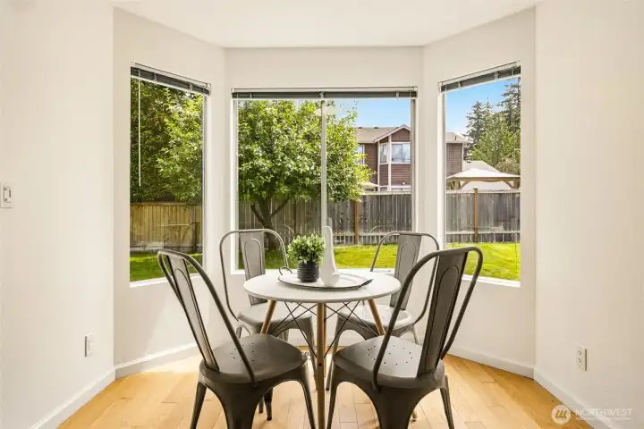 Dining nook with backyard views, creating a comfortable setting for casual meals, morning coffee, or everyday gatherings. Dining nook with backyard views, creating a comfortable setting for casual meals, morning coffee, or everyday gatherings.