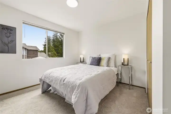 Secondary bedroom with natural light and flexible use as a guest room, home office, hobby space, or additional bedroom. Secondary bedroom with natural light and flexible use as a guest room, home office, hobby space, or additional bedroom.