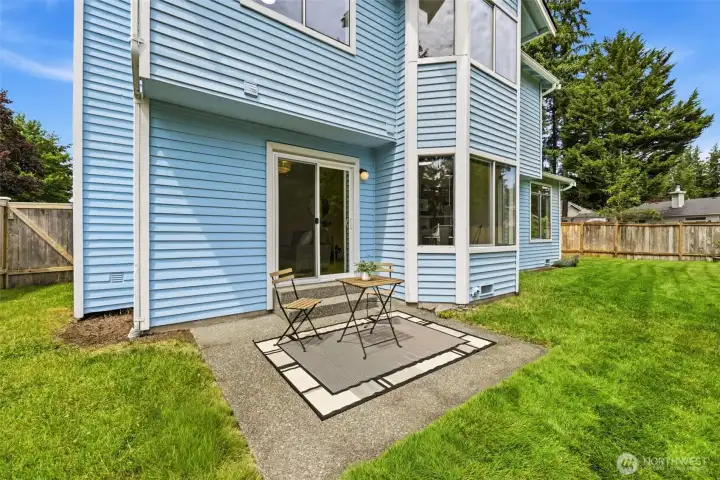 Backyard patio area offering space for outdoor dining, grilling, and relaxing while enjoying the private yard. Backyard patio area offering space for outdoor dining, grilling, and relaxing while enjoying the private yard.