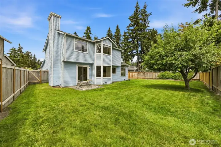 Large fenced backyard with mature landscaping, berry bushes, apple tree, and room to enjoy the outdoors. Large fenced backyard with mature landscaping, berry bushes, apple tree, and room to enjoy the outdoors.