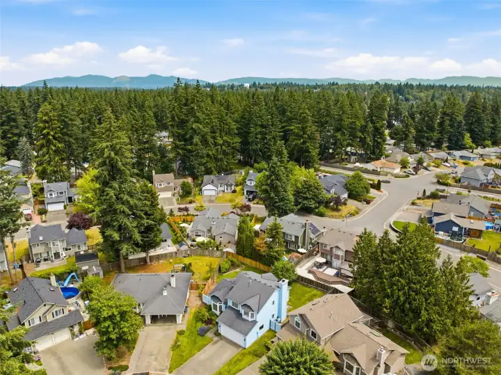 Bird's eye view of the surrounding community showcasing neighborhood character and convenient residential living. Bird's eye view of the surrounding community showcasing neighborhood character and convenient residential living.