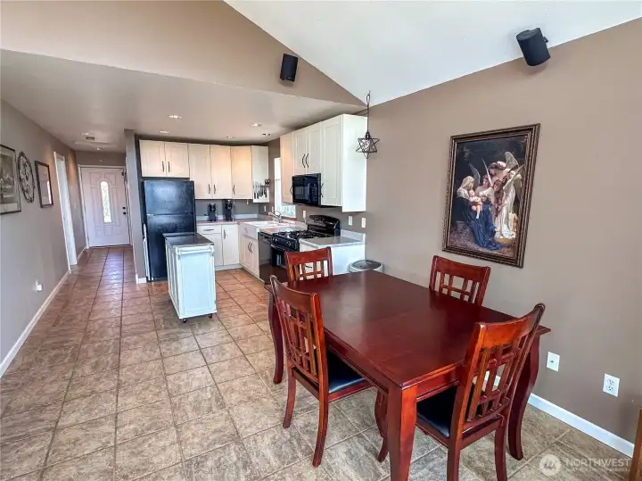 Gorgeous dining table and another view of the large kitchen space.