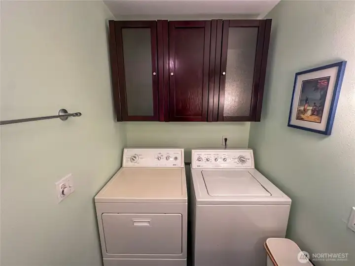 Laundry space is also included in the spacious bathroom.