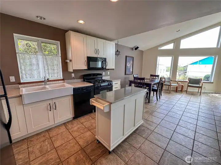 Head back down the hallway and enter the kitchen/great room.