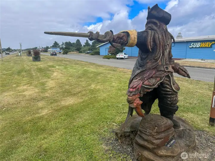 One of several fun wooden sculptures. This pirate points ye in the direction of the ocean!