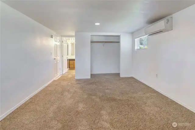 Primary Bedroom is large with windows for ambient light.