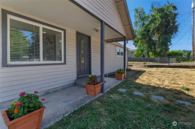 Inviting front porch to catch afternoon sun!