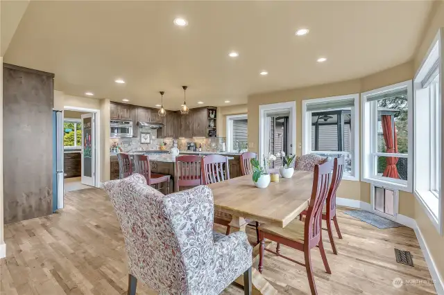 Kitchen and Dining Leading Out to Deck