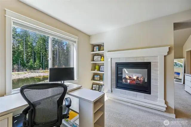 What a great work area in the primary suite with beautiful views and the gas fireplace.