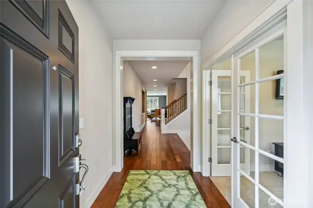 Enter on to gorgeous hardwood floors and notice the beautiful millwork. To the right is one of two main floor offices.