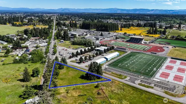 Sitting on a corner lot with road frontage on both Yelm Ave and 93rd. Blue boundary lines are approximate. Buyer to verify to their own satisfaction.