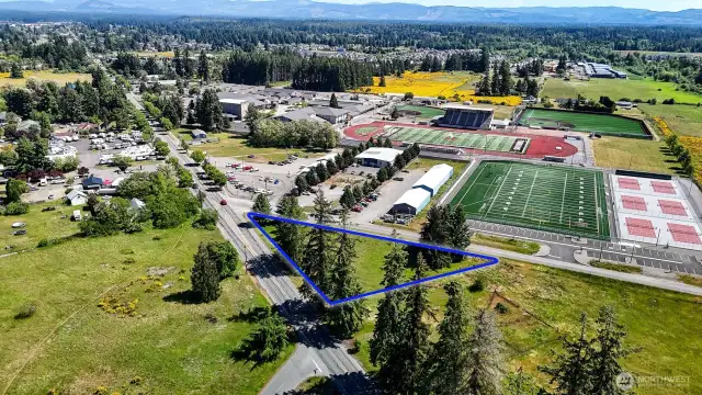 0.83 acres, level and ready for development. Blue boundary lines are approximate. Buyer to verify to their own satisfaction.