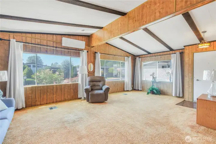 Living room with vaulted ceilings.