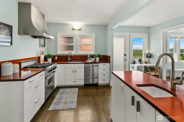Kitchen is the heart of the home; with access from the office or hallway and open to the breakfast nook and living room. Door from breakfast nook for easy exterior access.