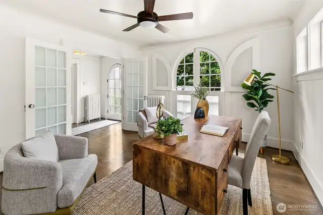 Bonus room at the entry is excellent office or TV space. Arched windows are doors which fully open.