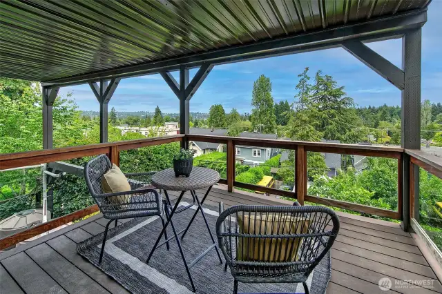 Middle level deck; covered from the elements and accessed from a middle floor bedroom. Look at those great views!