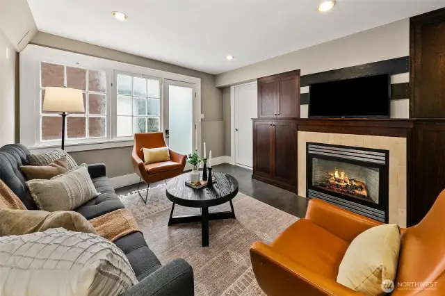 Middle level living room with gas fireplace.