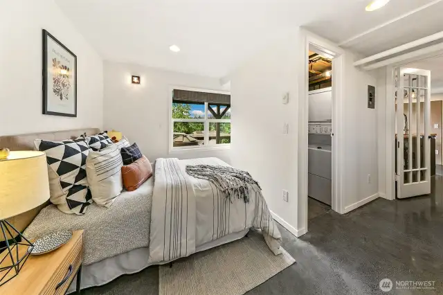 Lowest level bedroom; this space has been used as a separate rental unit in the past. Fully equipped with w/d too.
