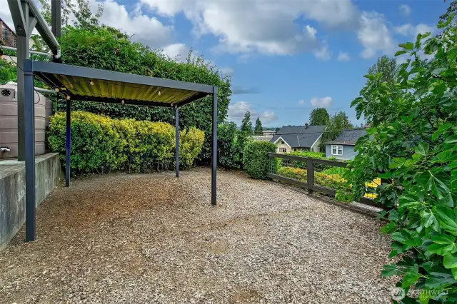 Fully fenced backyard with covered gazebo - year round outdoor enjoyment.