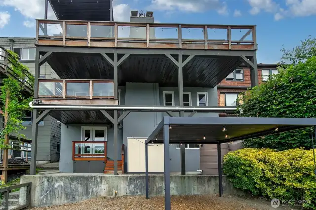 Perspective from exterior; Top floor is the main level with expansive view deck.