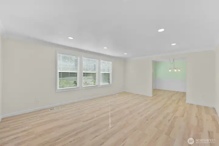 Large living room with dining room in back of photo.