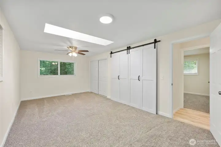 Primary bedroom with skylight