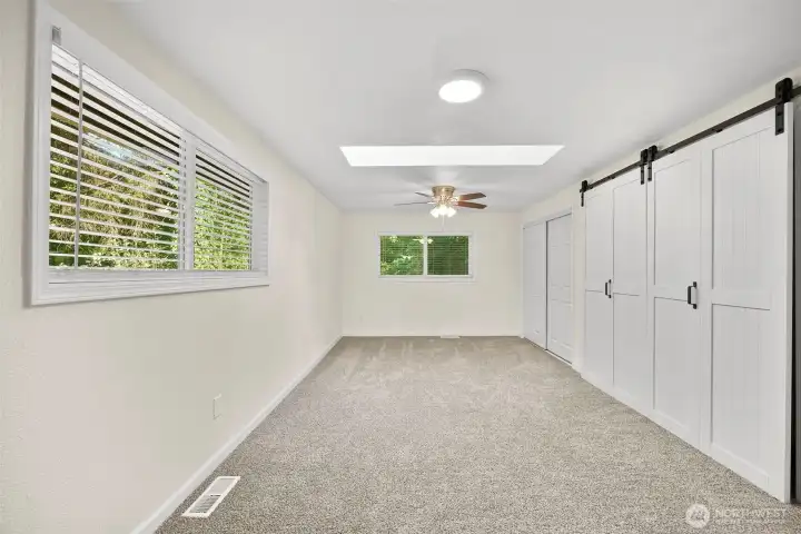 Primary bedroom with two massive closets
