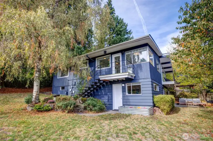 Door in kitchen takes you down to the back yard. Also see entry to downstairs bedroom/office.