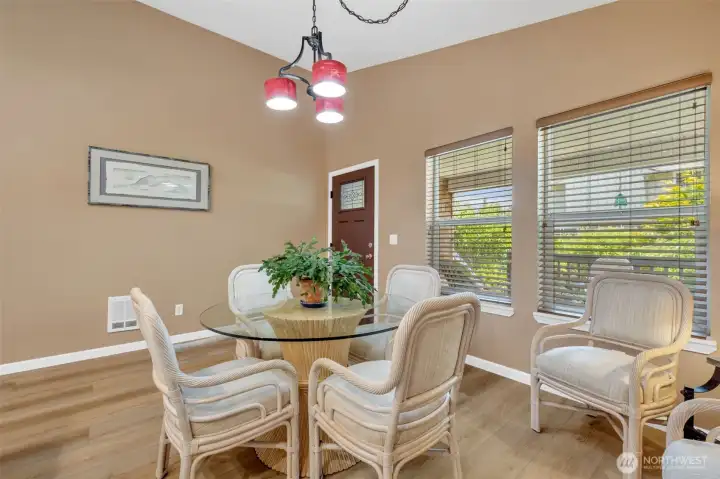 Very roomy dining room overlooking the serene backyard