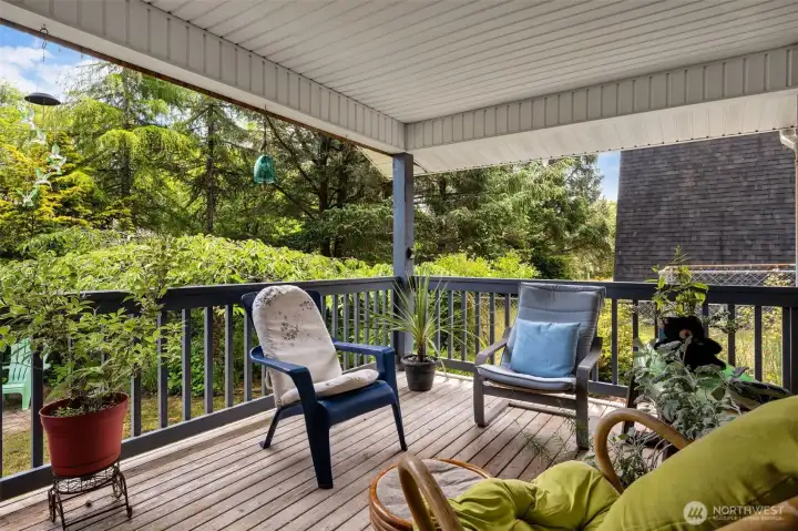 Covered back deck. Perfect for entertaining guests or enjoying a quiet evening