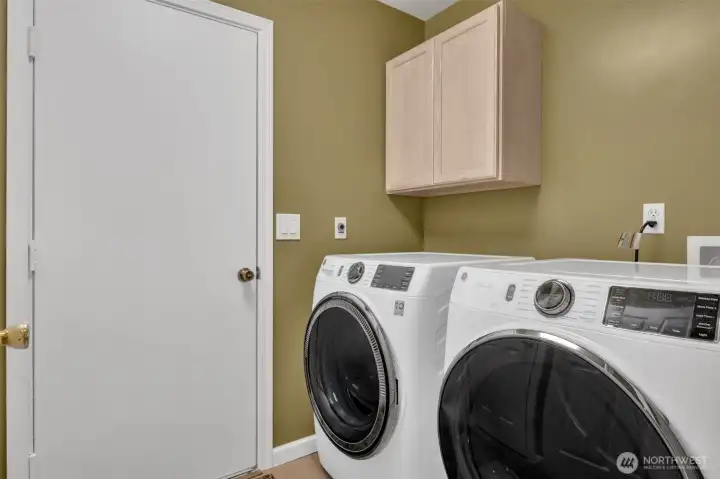 Utility room including front loading washer and dryer