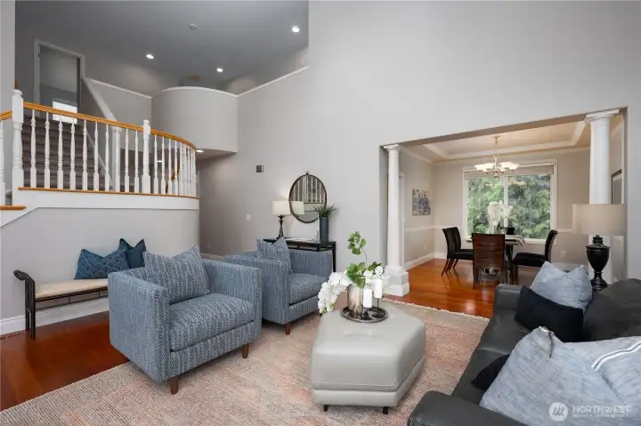 The front living room feels extremely open with the massively tall ceilings.