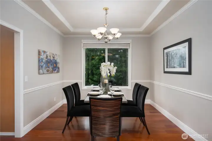 From the large living room, the space opens to a formal dining room.