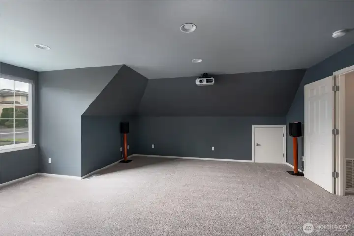 Speakers and projector will remain. Small door leads to attic space.