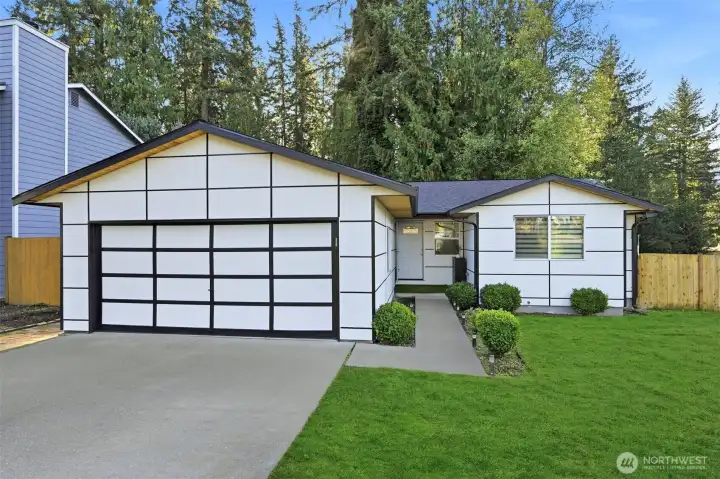 Beautifully-updated rambler on spacious corner lot.