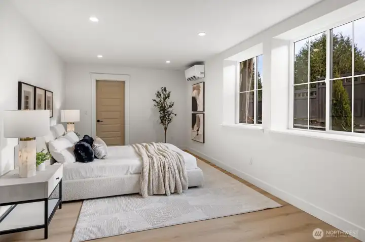 Primary bedroom with lots of natural light