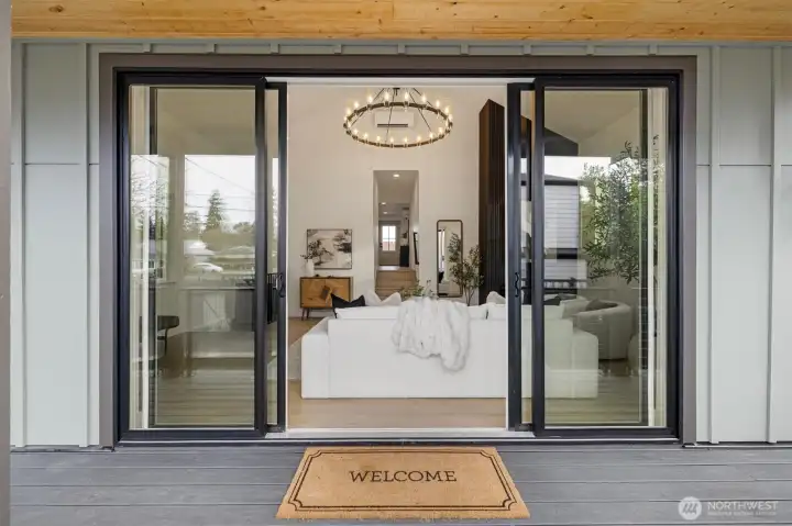 Oversized sliding doors lead onto the Trex Deck