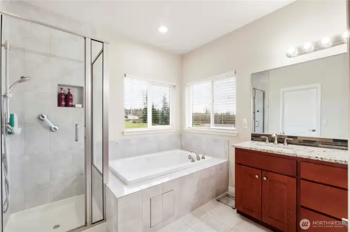 5 piece private primary bathroom with natural light.