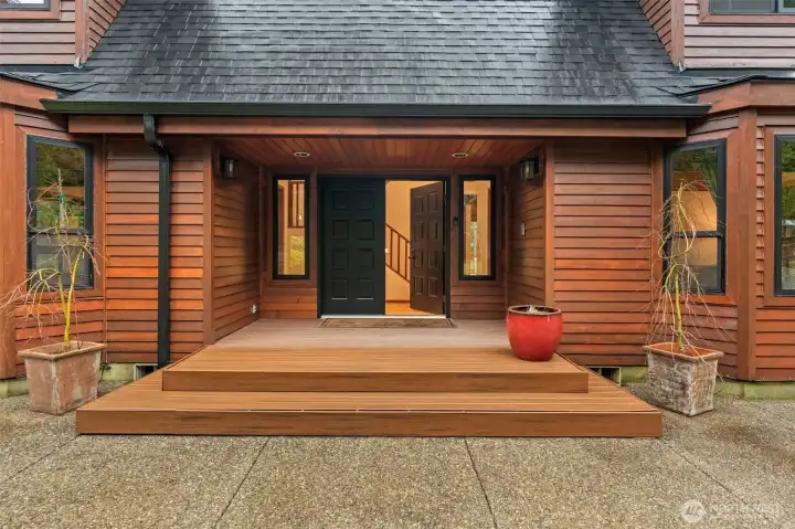 Rich wood tones and clean architectural lines create an immediate sense of home and high-end craftsmanship while entering this gorgeous home.