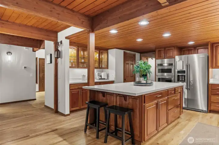 Modern luxury meets timeless craftsmanship. The sleek new hardware adds a crisp, contemporary touch to the stunning cabinetry and natural wood finishes.