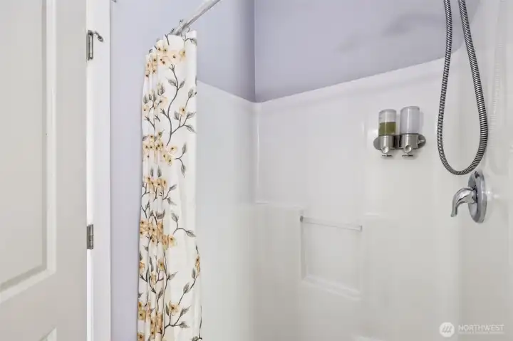 Primary suite step-in shower.