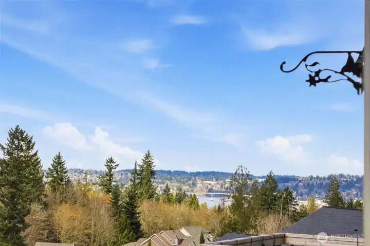 A northwestern view toward the Manette Bridge over the Sinclair Inlet's Port Washington Narrows waterway. There are Olympic Mountains behind the cloud cover as well.