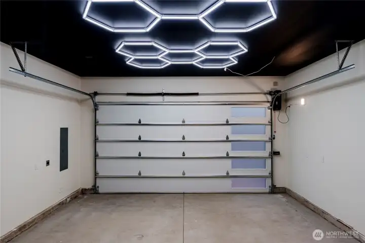 This is not your average garage! Custom lighting and paint help create showstopper garage!