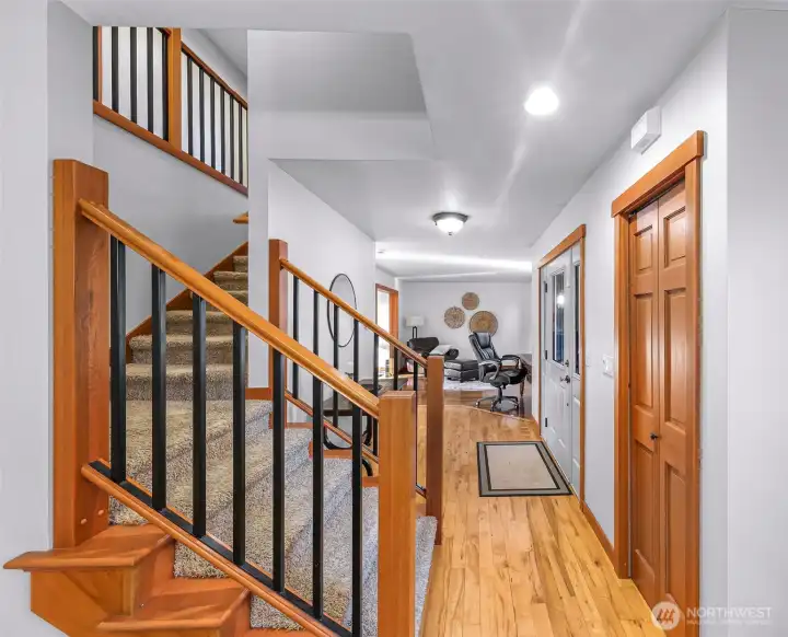 Interior stairway features warm wood  detailing and solid craftsmanship. A  functional connection between levels that  adds architectural interest.