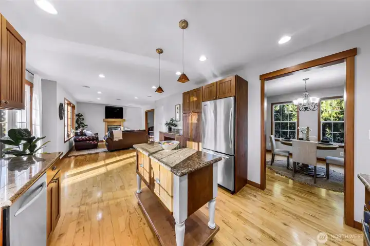 Kitchen angle featuring clean lines and  updated appliances, including a new range.  Practical layout supports daily routines and  entertaining alike.