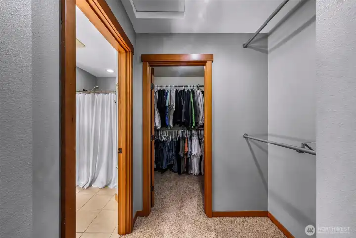 Walk-in closet provides generous storage  and organization space. Designed for ease  and accessibility.