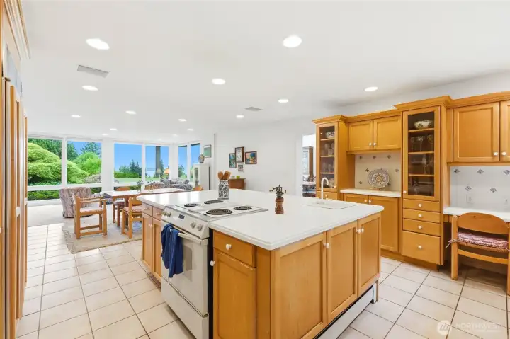 Spacious kitchen with large island and many cabinets.