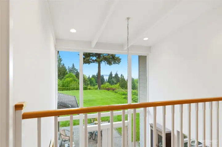 Let go upstairs.  The exposed hallway separates the primary suite from the additoinal 3 bedrooms.