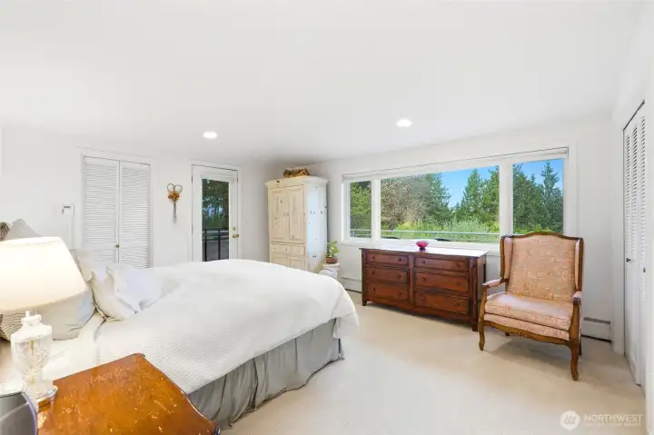 Primary suite with Puget Sound View, private balcony, and den (which is technically a 5th bedroom).